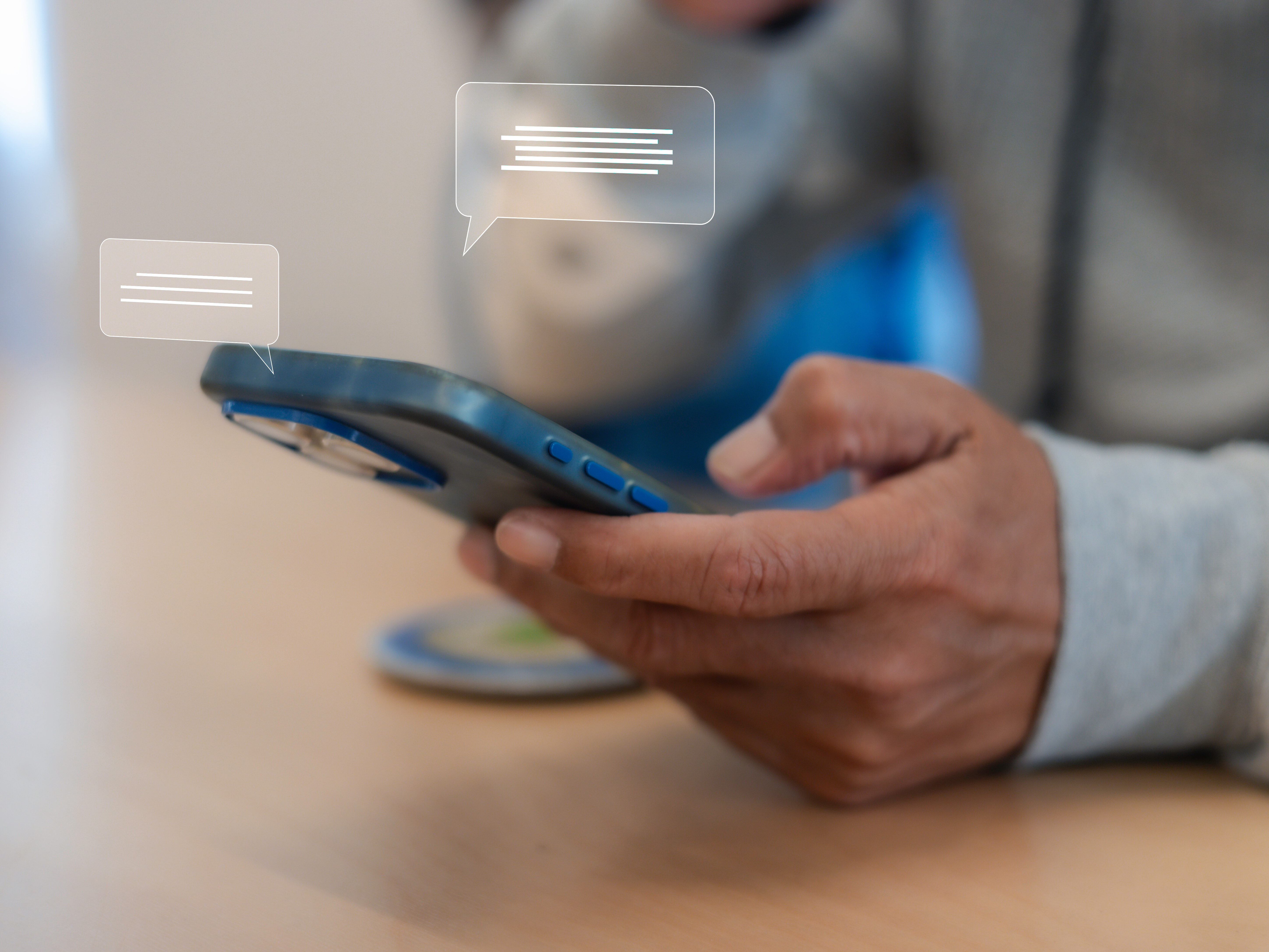 Close up man using smart phone, Social media marketing concept. hand using smartphone typing, chatting conversation in chat box icons pop up